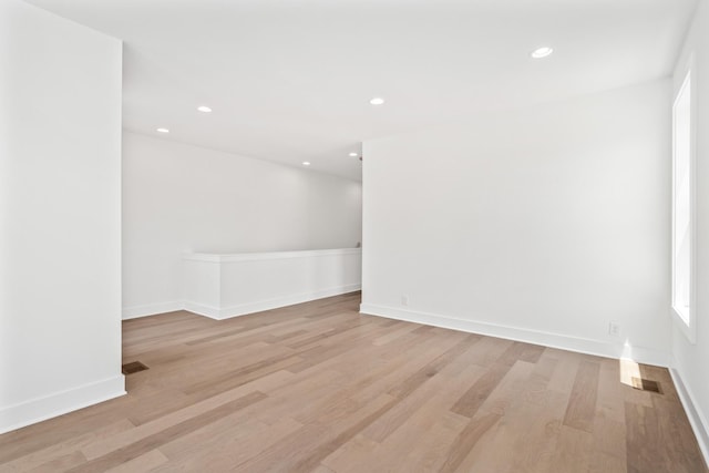 spare room featuring light hardwood / wood-style floors