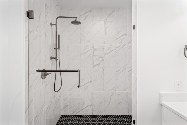 bathroom with an enclosed shower and vanity