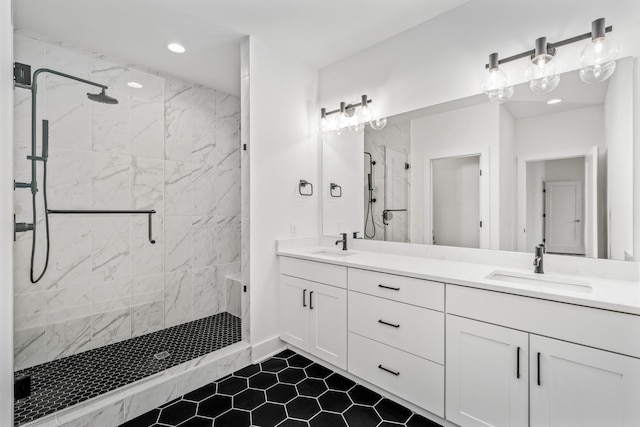 bathroom with vanity and a shower with shower door