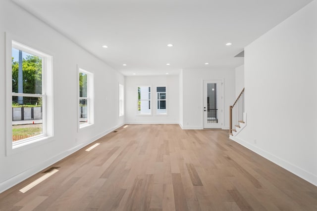 unfurnished living room with light wood-type flooring