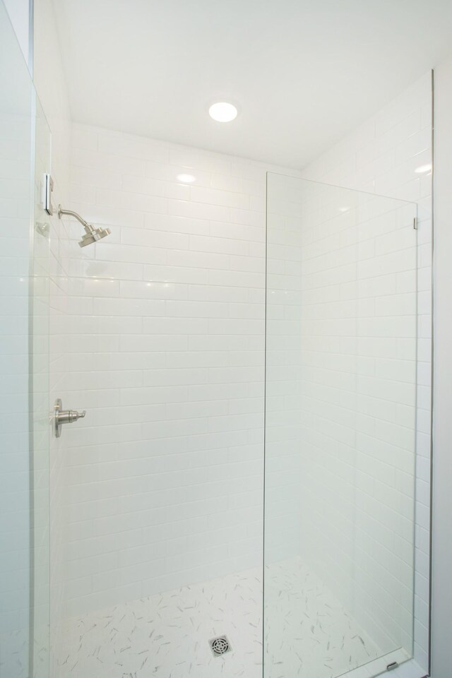 bathroom with tiled shower