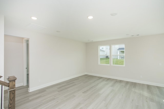 spare room featuring light hardwood / wood-style floors