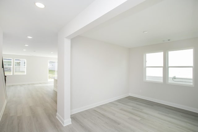 unfurnished room with light wood-type flooring