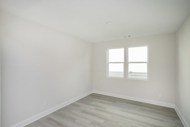 unfurnished room featuring light wood-type flooring