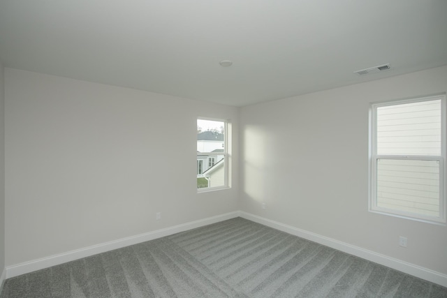 spare room featuring carpet floors