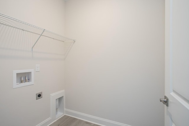 laundry room featuring washer hookup, light wood-type flooring, and electric dryer hookup