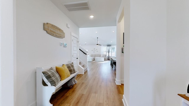 corridor with light hardwood / wood-style flooring