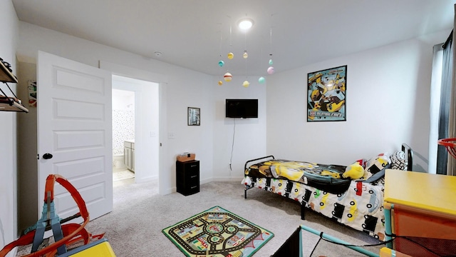 carpeted bedroom with ensuite bathroom