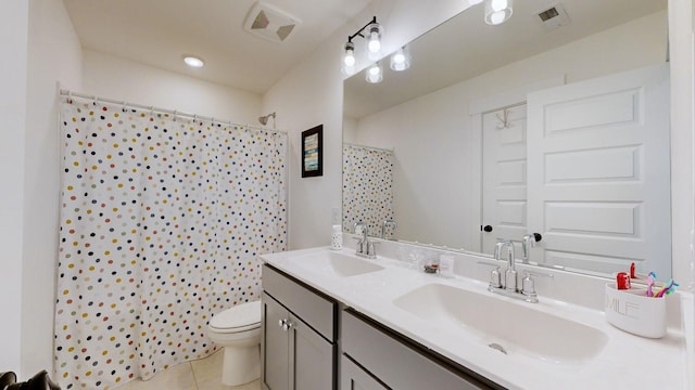 bathroom with toilet, vanity, tile patterned floors, and a shower with shower curtain