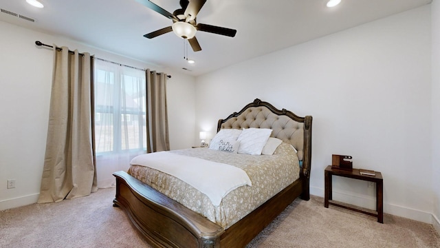 carpeted bedroom with ceiling fan