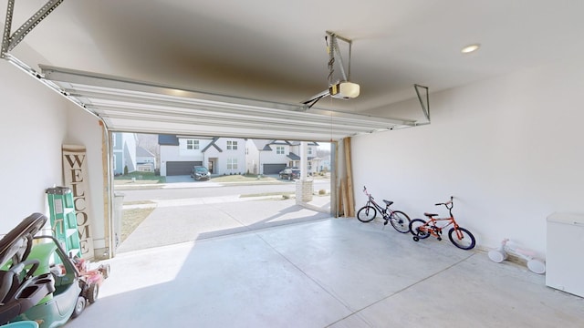 garage with a garage door opener and refrigerator