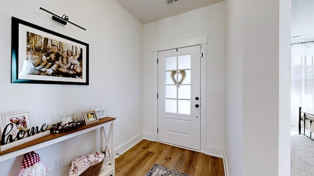 foyer entrance featuring plenty of natural light and light hardwood / wood-style floors