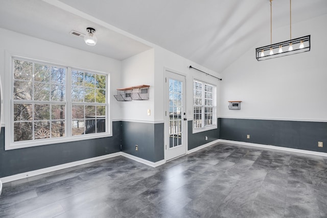 interior space featuring french doors, lofted ceiling, and a wealth of natural light