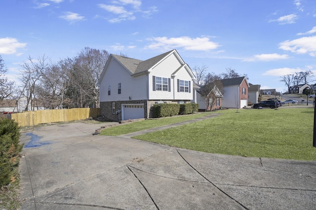 view of front of home featuring a garage and a front yard