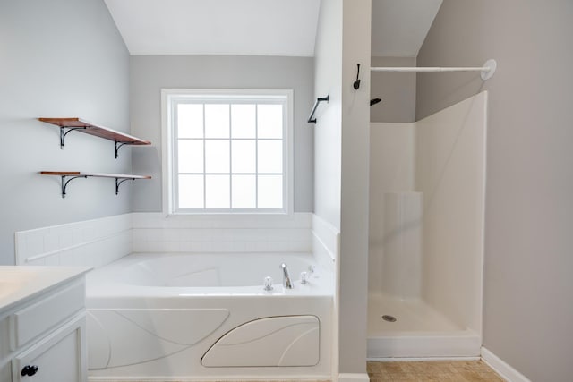 bathroom featuring vanity and separate shower and tub