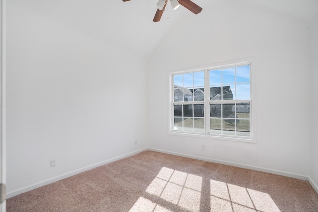 carpeted spare room featuring high vaulted ceiling and ceiling fan