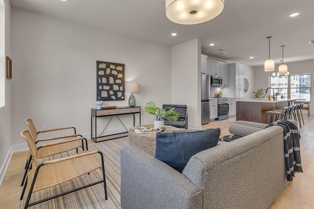 living room with light hardwood / wood-style floors