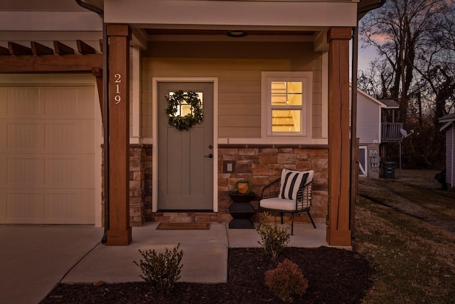 exterior entry at dusk with a garage