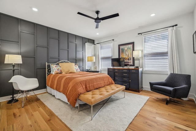 bedroom featuring ceiling fan and light hardwood / wood-style flooring