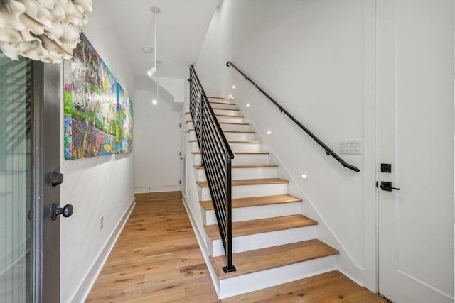 stairway with wood-type flooring