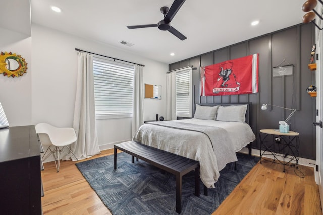 bedroom with ceiling fan and light hardwood / wood-style floors