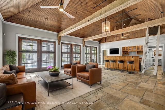 living room with french doors, ceiling fan, and wood ceiling