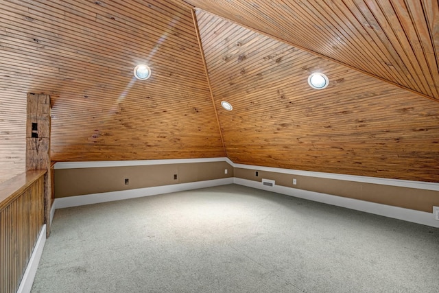 additional living space with vaulted ceiling, carpet, and wooden ceiling