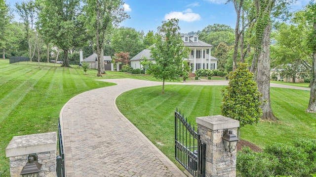 view of home's community featuring a lawn