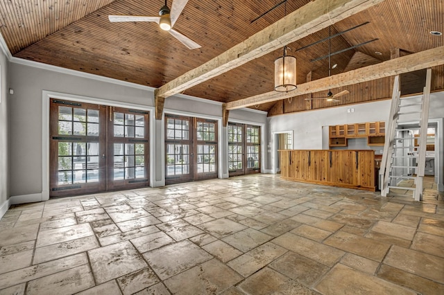 unfurnished living room with french doors, ceiling fan, wood ceiling, and a high ceiling