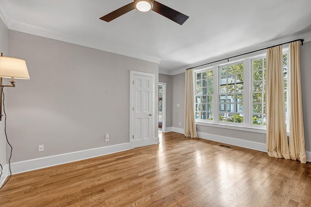 unfurnished room with crown molding, ceiling fan, and light hardwood / wood-style floors