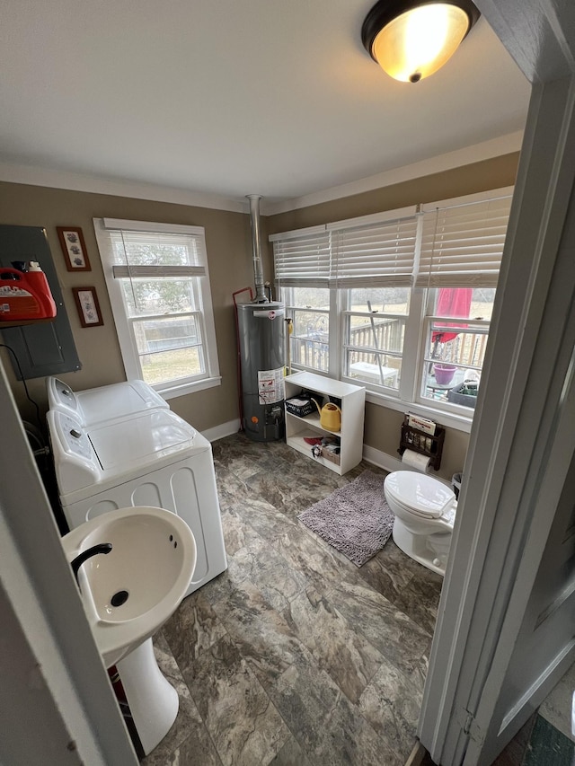 bathroom featuring washer and clothes dryer and water heater