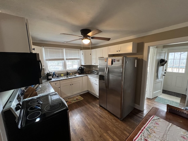 kitchen with stainless steel fridge, dark hardwood / wood-style floors, white cabinets, and black electric range