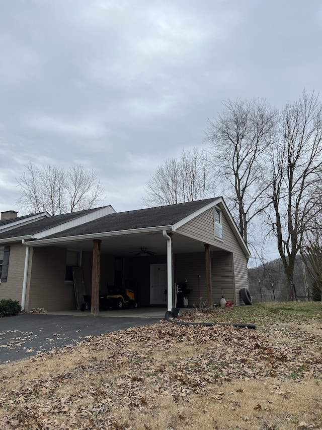 view of side of property featuring a carport