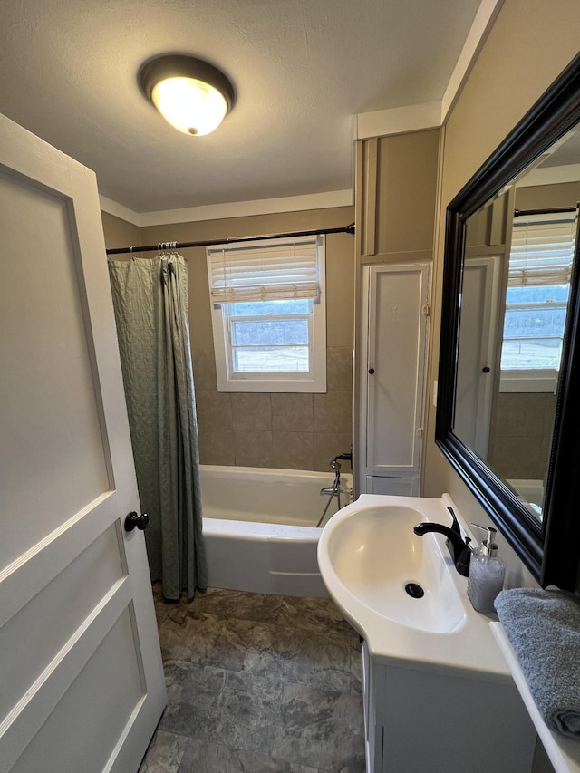 bathroom featuring shower / tub combo with curtain and vanity