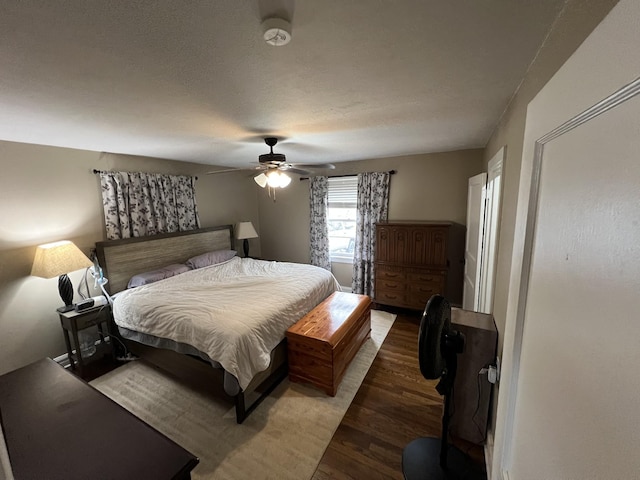 bedroom with hardwood / wood-style flooring and ceiling fan