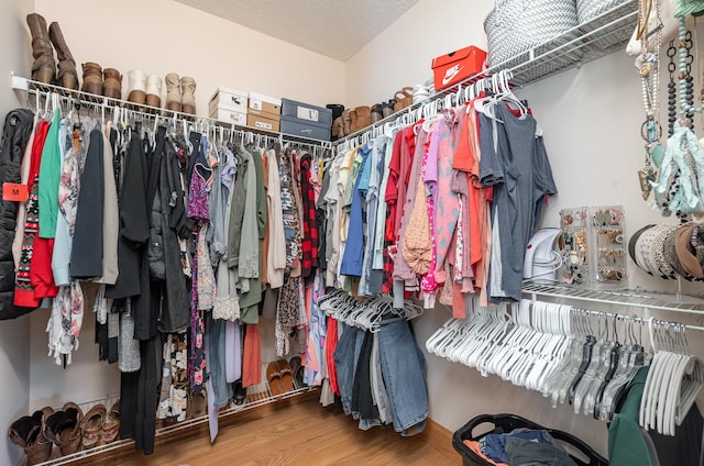 walk in closet featuring hardwood / wood-style floors