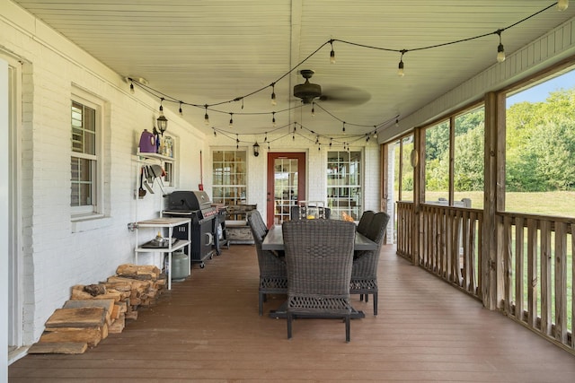 exterior space with ceiling fan