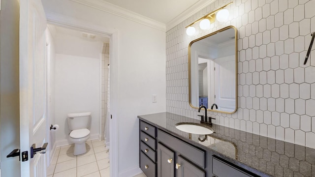 bathroom with vanity, tile patterned floors, ornamental molding, and toilet