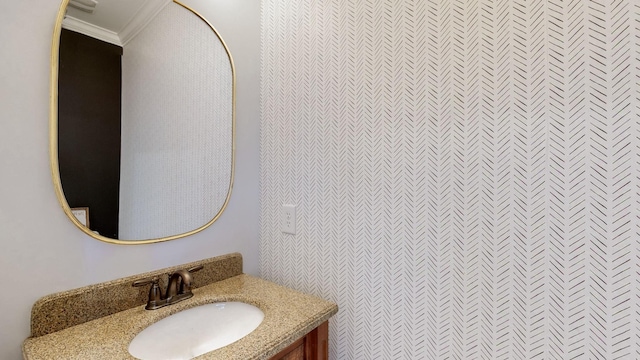 bathroom featuring crown molding and vanity