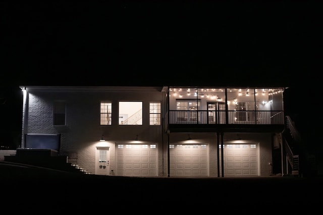 back house at twilight with a garage