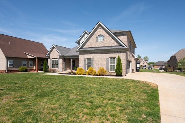 view of front of property with a garage and a front yard