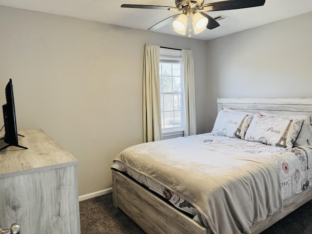 bedroom with dark carpet and ceiling fan