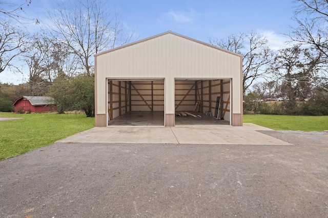 garage with a yard