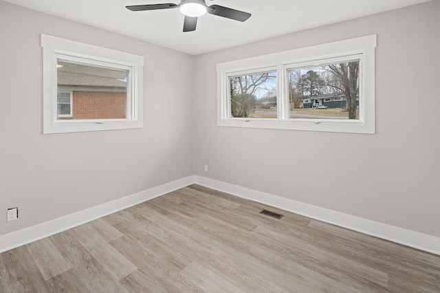 unfurnished room with ceiling fan and light hardwood / wood-style floors