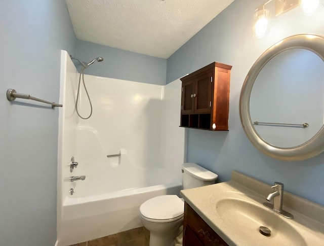 full bathroom featuring vanity, toilet, a textured ceiling, and washtub / shower combination