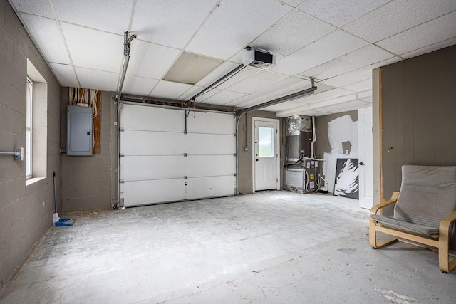 garage featuring a garage door opener and electric panel