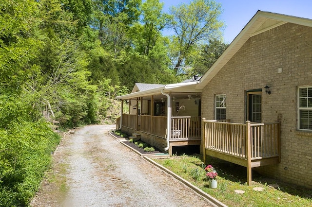 view of side of home with a porch