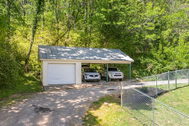 exterior space with a carport and a garage