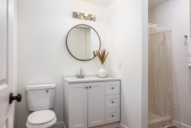 bathroom with vanity, toilet, and a shower with shower curtain