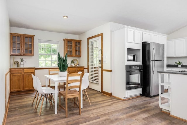 dining area with hardwood / wood-style floors